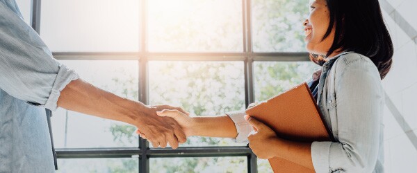 Woman Shaking Hands With Boss