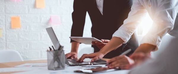 Two people at a work table planning out a business process