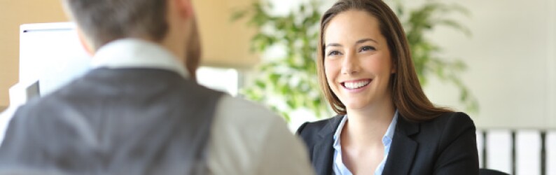 Young Professional Discusses Tuition Reimbursement With Manager