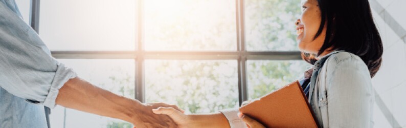Woman Shaking Hands With Boss